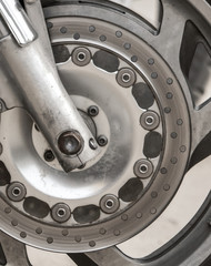 Metal parts on a motorcycle as a background