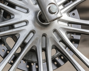Metal parts on a motorcycle as a background