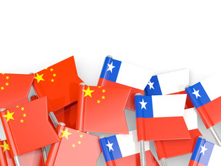 Pins with flags of China and chile isolated on white.