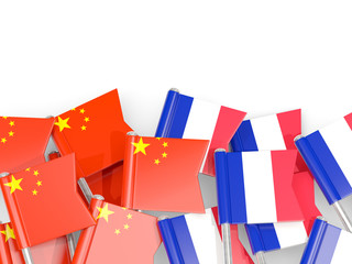 Fototapeta na wymiar Pins with flags of China and france isolated on white.