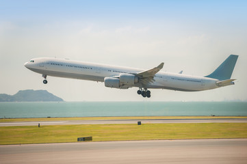 Fototapeta na wymiar Departure of the aircraft from Hong Kong airport