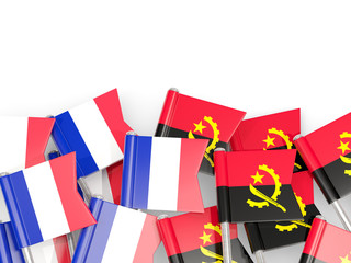 Fototapeta na wymiar Pins with flags of France and angola isolated on white.
