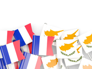 Pins with flags of France and cyprus isolated on white.