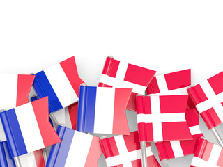 Fototapeta na wymiar Pins with flags of France and denmark isolated on white.