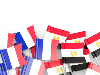Fototapeta na wymiar Pins with flags of France and egypt isolated on white.