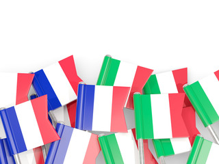 Pins with flags of France and italy isolated on white.