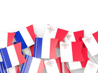 Fototapeta na wymiar Pins with flags of France and malta isolated on white.