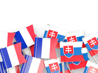 Pins with flags of France and slovakia isolated on white.