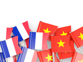 Fototapeta na wymiar Pins with flags of France and vietnam isolated on white.