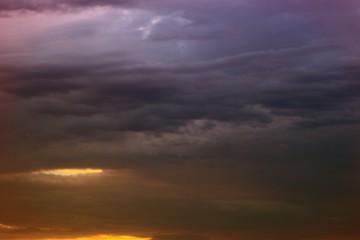 lovely vivid sun colored clouds in the sky for using in design as background.
