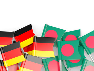 Pins with flags of Germany and bangladesh isolated on white.