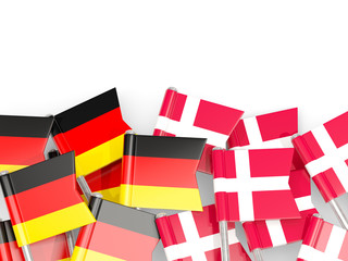 Pins with flags of Germany and denmark isolated on white.