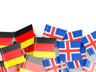 Fototapeta na wymiar Pins with flags of Germany and iceland isolated on white.