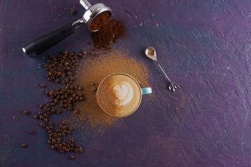 Cinnamon and coffee on a colored concrete background