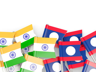 Pins with flags of India and laos isolated on white.