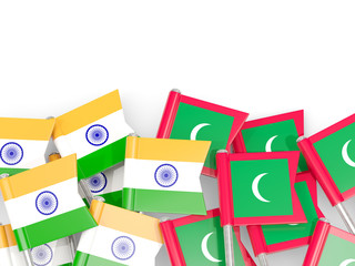 Pins with flags of India and maldives isolated on white.