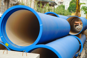 Corrugated water pipes of blue color, large diameter, prepared for laying.