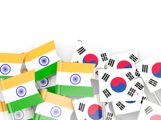 Pins with flags of India and south korea isolated on white.