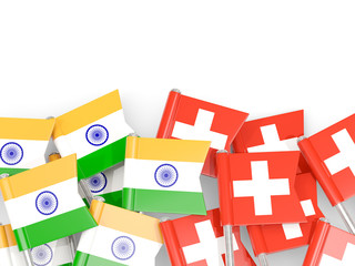 Pins with flags of India and switzerland isolated on white.