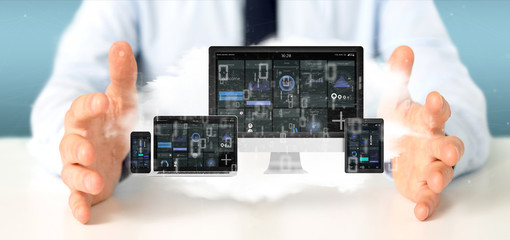 Businessman holding Devices connected to a cloud multimedia network 3d rendering