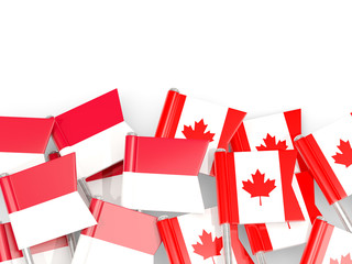 Pins with flags of Indonesia and canada isolated on white.