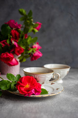 Tea set with red roses