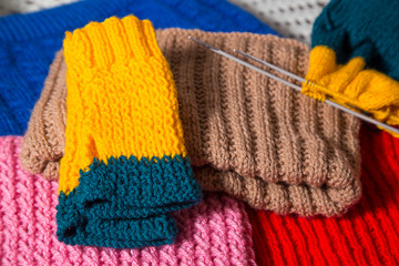 Wool handmade clothing with sewing needles.