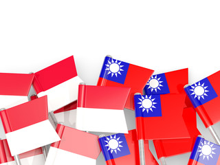 Fototapeta na wymiar Pins with flags of Indonesia and taiwan isolated on white.
