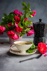Coffee time with red roses
