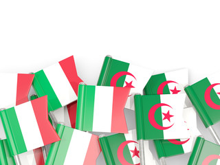 Pins with flags of Italy and algeria isolated on white.