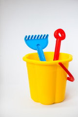 Bright children toys for playing in the sandbox on a white background