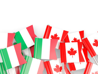 Fototapeta na wymiar Pins with flags of Italy and canada isolated on white.