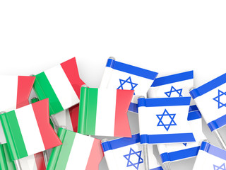 Fototapeta na wymiar Pins with flags of Italy and israel isolated on white.