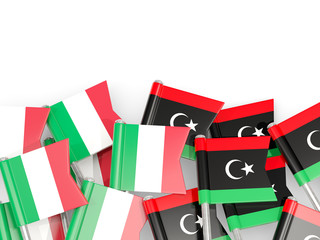 Fototapeta na wymiar Pins with flags of Italy and libya isolated on white.