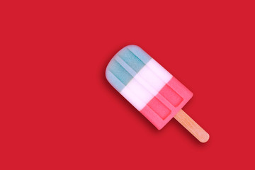 Flat lay of colorful ice cream on the modern rustic on red background at home office desk wallpaper, top view colorful ice cream pattern on red pastel background. Minimal summer concept.