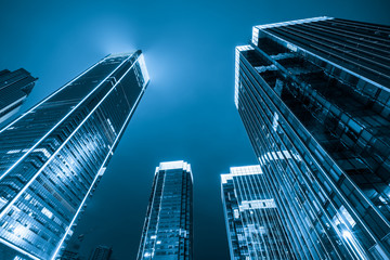 Looking up at the skyscrapers of the financial center at night © onlyyouqj