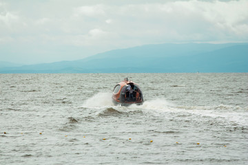 Water Taxi capsule in the blue sea