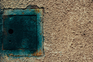 The blue metal plate on a concrete wall