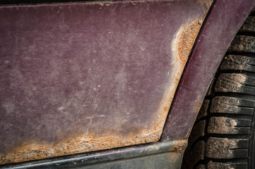 Rust spots on burgundy color car