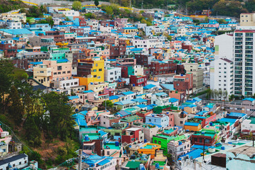 Scenic landscape of Gamcheon Culture Village, colorful and artistic tourist attraction with brightly painted houses on hillside of coastal mountain in Saha District, Busan, South Korea