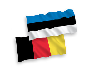 National vector fabric wave flags of Estonia and Belgium isolated on white background. 1 to 2 proportion.