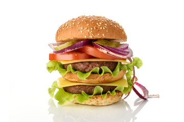 Big fresh tasty burger on wooden board isolated on white background