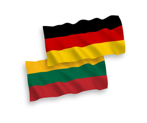 National Vector Fabric Wave Flags of Germany and Lithuania Isolated on White Background. 1 to 2 proportion.