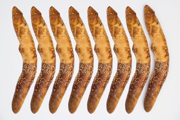 Traditional Balkan baguettes on white background.