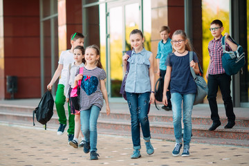 Fototapeta premium Group of kids going to school together.