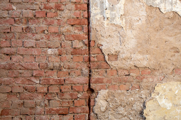 Old Weathered Dirty Damaged Wall With a Few Red Bricks Visible