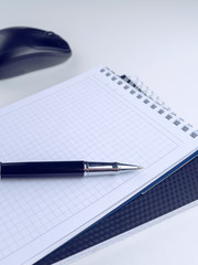 White wooden table with pen, mouse, notebook, . Workspace with copy space.