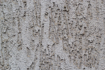 uneven runny grey texture of the wall