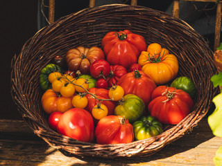 Close up view on fresh tomatoes in a basket at a market