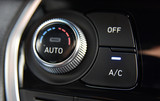 button for activating the air conditioners on the dashboard passenger car